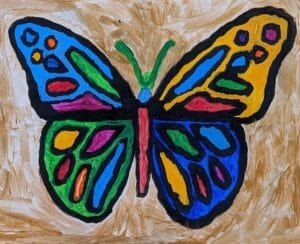 “Wingsworth” – A Vibrant Butterfly Painting by Autistic Artist Drew A colorful butterfly painting titled "Wingsworth," created by autistic artist Drew Whitaker. Featuring vivid blues, oranges, purples, and yellows against a neutral tan background, this artwork highlights the delicate beauty and grace of a butterfly in flight.